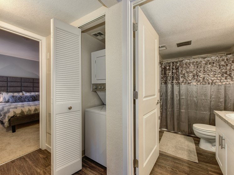 In Unit Washer Dryer, Hardwood Inspired Floor and Bathroom with Shower Curtains